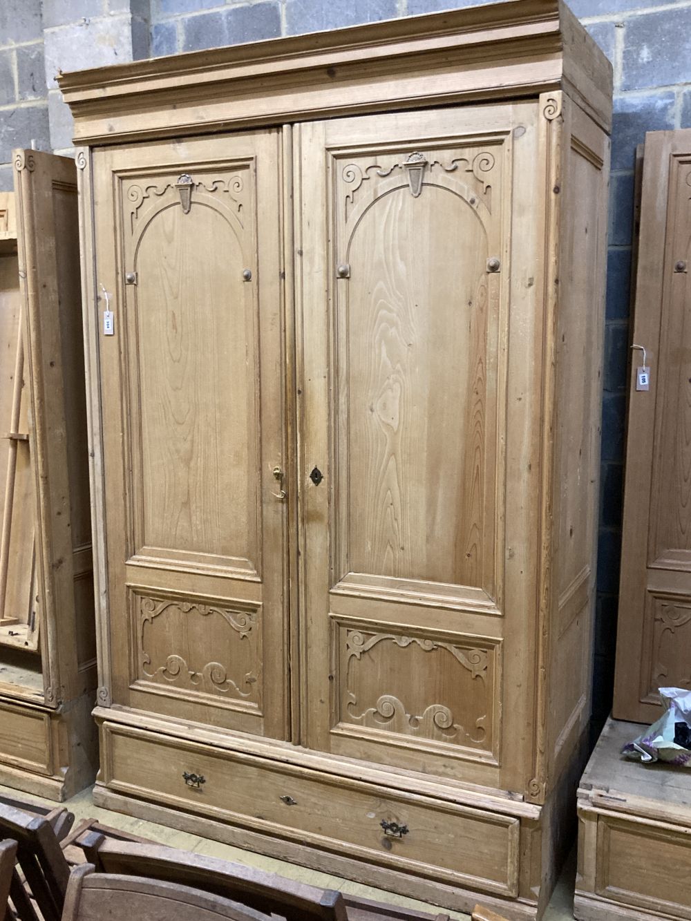 A 19th century French pine two door knockdown wardrobe with drawer and base, width 152cm depth 66cm height 234cm